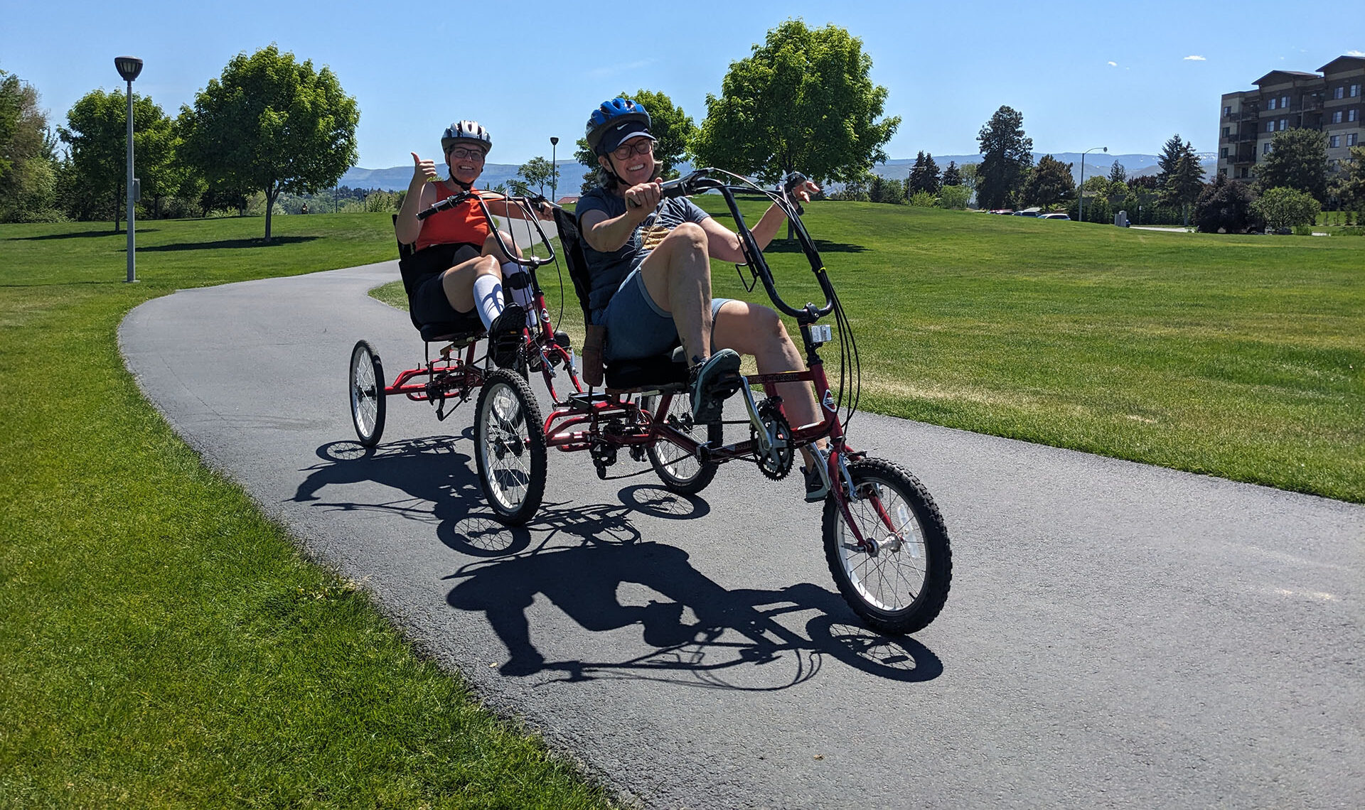 people on adaptive cycles outside
