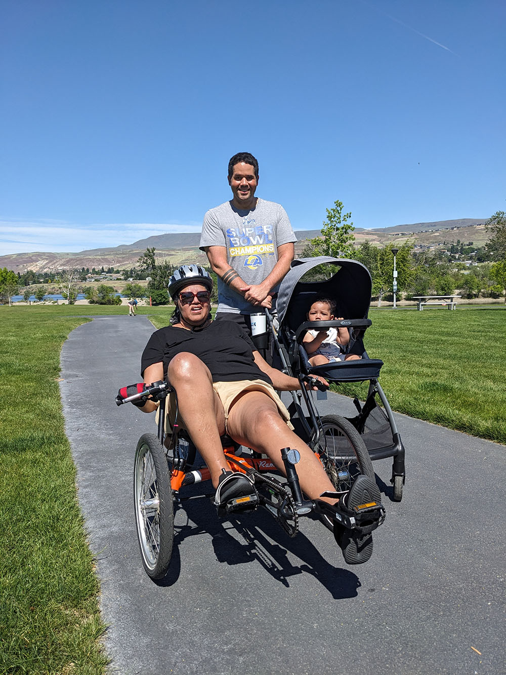 people on adaptive cycles outside