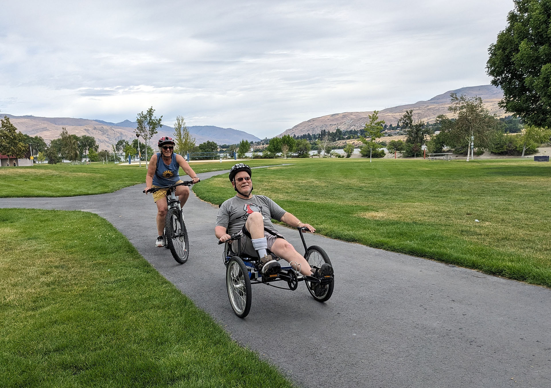 people on adaptive cycles outside